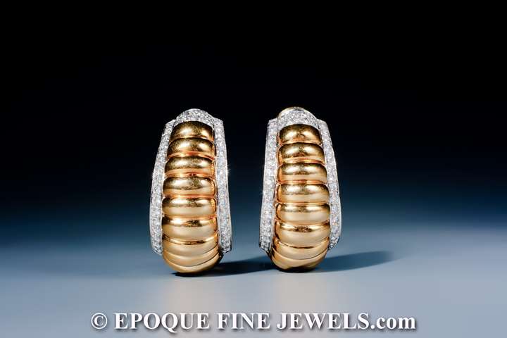 A fine pair of 18 karat gold and diamond earrings,   